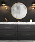 Bathroom vanity with black drawers and brushed nickel cabinet handles 10 pack, marble countertop, round mirror, wall sconces.