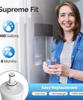 Woman using Replacement Refrigerator Water Filter 3 Pack That Keeps Your Ice Tasting Fresh Fits DA29-00003G in kitchen