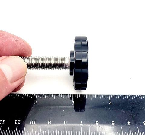 Side view of Three Eighths Inch Thumb Screw Bolts With Black Round Hex Head Clamping Knob Cap Grip next to a ruler