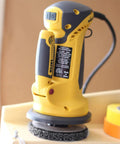 PaintEater Electric Palm Grip Paint Removal Sander Kit showing side view with 4-1/2 inch orbital disc and corded design.