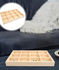 Solid Wood Jewelry Organizer Tray With Twelve Grid Compartments For Rings And Necklaces Vintage Decorative Vanity Holder on a dark sofa.