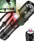 Beast Mode 10000 Lumen LED Flashlight With Digital Power Display, Zoomable Focus, shining on trees at night