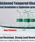 Workhorse Tempered Glass Lazy Susan Turntable with 6mm thick glass, demonstrating load bearing with water bottles.