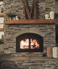 Cozy fireplace with stone surround and wooden mantel, featuring glowing flames and decorative accents in a warm setting.