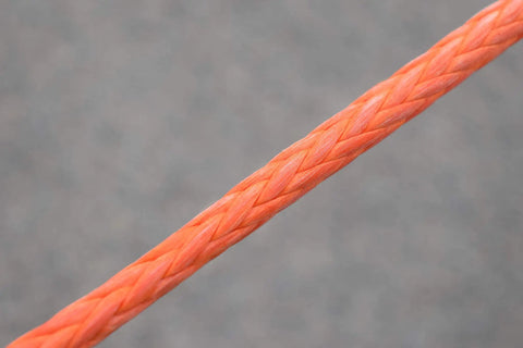 Close-up of orange Off Road Winch Rope Extension For ATV UTV Three Eighth Inch Synthetic Cable Eighty Four Feet Abrasion Resistant
