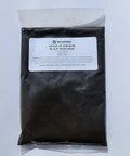 1 kg bag of black iron oxide pigment by Terrachrom for concrete and masonry