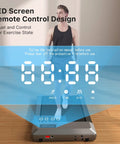 Portable Under Desk Walking Pad Treadmill With Remote And 300 Lb Capacity Hassle Free Setup Compact Home Office Fitness Gear to Clock Up Steps While You Type In Gray LED screen display shows speed, time, and distance.