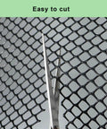 Scissors cutting Black Plastic Wire Mesh Roll 15.7In By 10Ft Chicken Wire Fence for versatility and ease of use