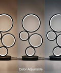 Four Circle Dimmable LED Table Lamp With Color Adjustable Light Modern Round Design 12W Black Finish showing color variations