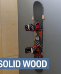 Sturdy Solid Wood Snowboard Rack Wall Mount For Home Or Garage Featuring Adjustable Width And Tight Grip Supports Holding Up To Thirty Pounds Hella Smooth Gear Storage, displaying a snowboard secured against a wall.
