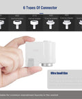 Hand holding small Hands Free Faucet Adapter For Kitchen And Bathroom Sink With 0.25 Second Sensing Dual Mode Touchless Technology