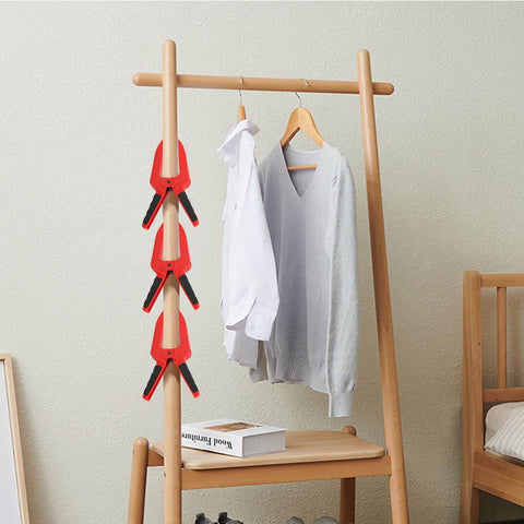 Grippy Woodworking Spring Clamp With Long Flat Nose For Precise Glue Ups And Fixture Work Plastic Handle Heavy Duty Metal Spring 3 Inch Opening Deep Jaw Reach 110mm Length 75mm Jaw Depth Red on clothing rack in living room