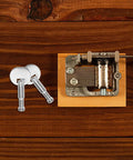 Music Box Winding Key Replacement Round Handle 1.57 Inch For Standard Movements on wooden table with metal parts