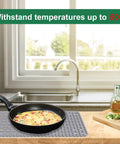 Silicone Sink Protector Mat For Kitchen Sink 28x15 Inches Heat Resistant No Slip Grid in use with hot pan beside kitchen sink