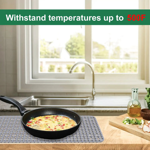 Silicone Sink Protector Mat For Kitchen Sink 28x15 Inches Heat Resistant No Slip Grid in use with hot pan beside kitchen sink