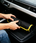 Person placing Drill Bit Organizer Roll Up Case With Zipper Heavy Duty Bit Holder Pouch in car's glove compartment