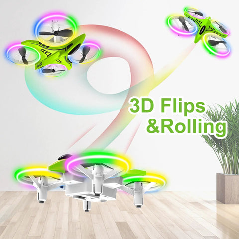 Crash Proof Mini Drone for Kids With LED Night Lights One Key Takeoff and Landing Flips RC Remote Control Easy for Beginners 3 Speed Modes Auto Hovering Nano Quadcopter Green in mid-air performing 3D flips over a wooden floor with LED lights glowing in a pattern.