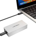 Fast Usb4 To Nvme Enclosure Syncing Thunderbolt 5 connected to a laptop, showcasing a sleek machined aluminum design.