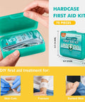 Teal hardcase first aid kit, 70-piece, 6-pack, opened to show stacked medical supplies