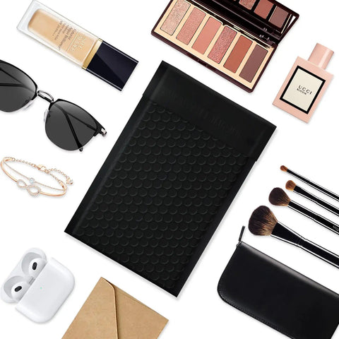 4x8 Inch Black Bubble Mailers 40 Pack Self Seal Padded Envelopes with accessories like sunglasses and cosmetics.