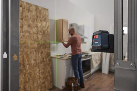 Rechargeable Self Leveling Cross Line Laser With Dual Power Options AA Batteries Or Li Ion Pack IP55 Rugged Jobsite Ready Bright Fine Line Projection For Precise Layouts Quick Setup And Durable Build on kitchen cabinet install
