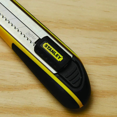 Close-up of the FatMax Snap Off Knife, durable utility knife with ergonomic grip and easy blade change on wooden surface.