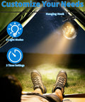 Person relaxing in a tent with Magnetic Golf Cart Clip On Mist Fan With Light On The Go, 3 light modes visible.