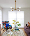 Living room with 4 Light Sputnik Chandelier With Rotatable Lamp Cups, Dope Modern Gold Bronze Pendant Lighting, Semi Flush Mount Ceiling Fixture, Mid Century Style For Dining Room, Kitchen Island, Bedroom And Living Room UL Listed, colorful armchair, and purple sofa.