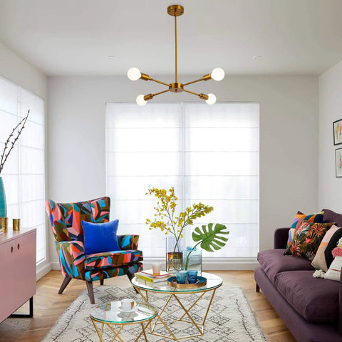 Living room with 4 Light Sputnik Chandelier With Rotatable Lamp Cups, Dope Modern Gold Bronze Pendant Lighting, Semi Flush Mount Ceiling Fixture, Mid Century Style For Dining Room, Kitchen Island, Bedroom And Living Room UL Listed, colorful armchair, and purple sofa.