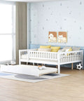 Full-Size Wood Daybed With Trundle And Fence Guardrails In White Finish in a children's room setting.