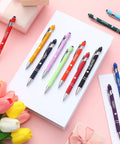12 Piece Funny Emergency Nurse Pens Bulk Retractable Writers With Killer Hospital Vibes Solid Steel Body And Touchscreen Stylus Tip on white notebook.