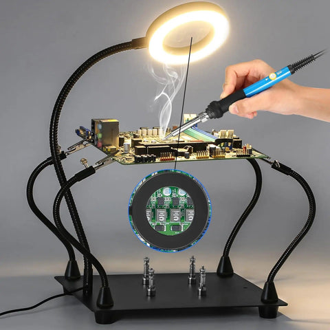 Soldering Magnifying Glass With Four Arm Magnetic Holder And 3X LED Light in use for circuit board repair, showing flexible arms and base.
