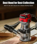 Beefy Compact Wood Router With 6.5 Amp 1.25 HP Power, Fixed Base, Includes Trim Bits, Six Variable Speeds, Edge Guide, Roller Guide, Dust Hood, 65mm Shaft, Red in use with dust hood on wood surface
