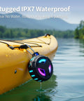 Bluetooth Shower Speaker With LED Light, IP67 Waterproof And Floating, 2000mAh Battery, attached to a yellow kayak on water.