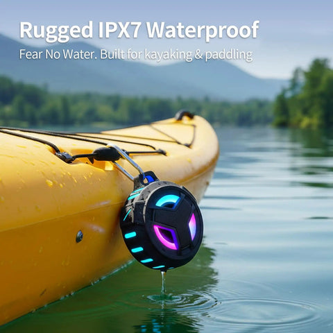 Bluetooth Shower Speaker With LED Light, IP67 Waterproof And Floating, 2000mAh Battery, attached to a yellow kayak on water.