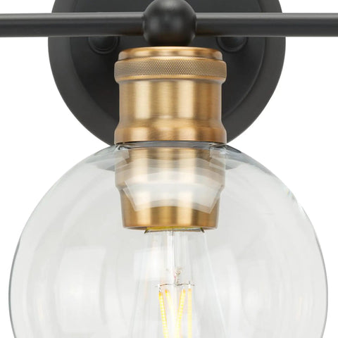 Close-up of glass globe on Coastal 3 Light Bath Vanity Light With Clear Glass Globes In Antique Bronze Finish, Modern Rustic Style