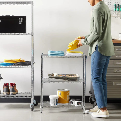 Person using Beefy Heavy Duty Steel Wire Shelving Rack With Chrome Finish 3 Shelf Adjustable Storage System No Tool Assembly