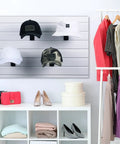 Six Pack Slat Wall Hat Display Racks Wire Headwear Organizer For Baseball Caps Beanies Wigs Metal Slatwall Accessories Ideal For Home Retail Store And Warehouse Black showing hats on a slatwall panel