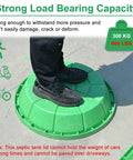 Person standing on heavy duty resin manhole cover for outdoor drainage, demonstrating strength, supports up to 300 kg (660 lbs)