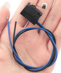 Black Waterproof Micro Switch With Roller Lever IP67 Sealed Limit Switch For Rugged Environments in hand, compact size.