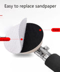 Close-up of the handheld wood turning lathe sander's replaceable sandpaper disc with flannel backing.