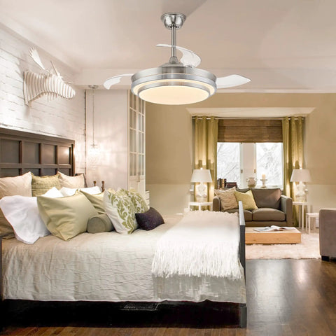 42 Inch Retractable Ceiling Fan With Remote, LED Lighting, And Brushed Nickel Finish installed in a modern bedroom