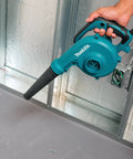 Person using Two In One Blower Vacuum With 145 CFM Air Volume And 203 MPH Air Speed Variable Speed Dial And Trigger indoors
