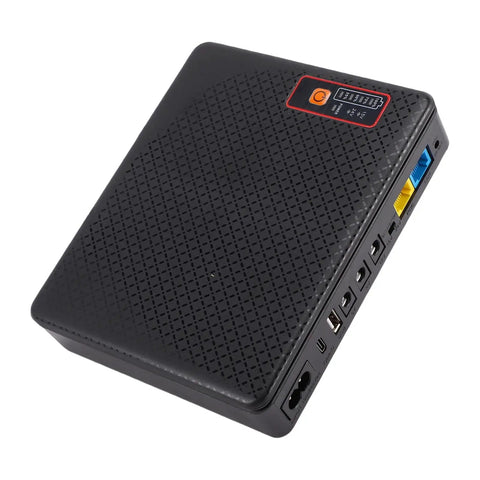Mini Ups Battery Backup 16000Mah Power Supply For Routers And Modems Us Plug shown from an angled top view with multiple ports.