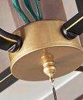 Close-up of the hanging mechanism of the Chinese Motif Ceiling Pendant Light With Modern Fabric Shade And Classic Enamel Design.