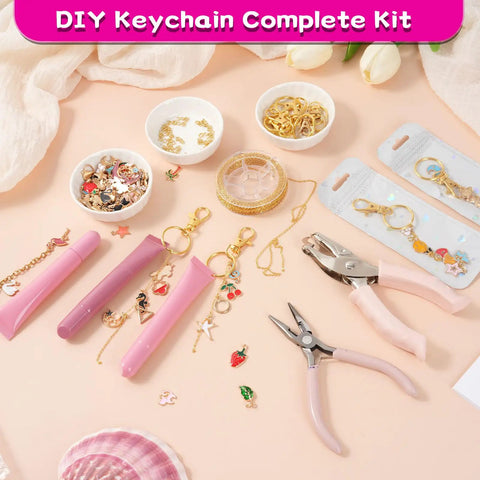 DIY Lip Gloss Keychain Craft Kit with Enamel Charms and Chains, pliers, hole punch, and pink tools on display