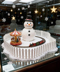 Three Piece 35 Inch White Mini Christmas Garden Fence For Fairy Gardens And Dollhouses Wood Picket Ornament Fence enclosing a snowman scene