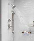Bancroft 3 Function Showerhead With Katalyst Massage And Silk Sprays In Vibrant Brushed Nickel MasterClean Nozzles For No Fuss Cleaning And Smooth Transitions Shower Arm Not Included in a modern bathroom setting.