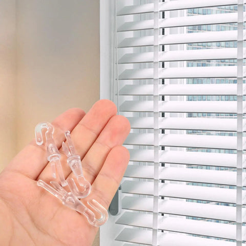 Rock Solid 12 Piece Blind Wand Replacement Hooks Built With Heavy Duty Alloy For Smooth Tilt Action And Fast Window Treatment Repairs Around Your Place, clear clips held in a hand.