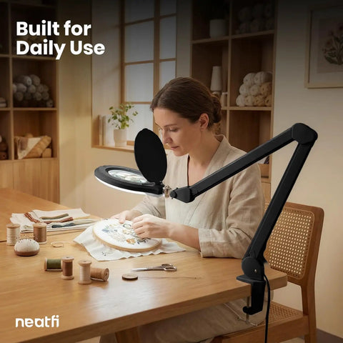 Woman using Pro Grade LED Magnifying Lamp With Clamp, 6 Inch Glass Lens, 5D And 12D Bifocal Magnification for embroidery work